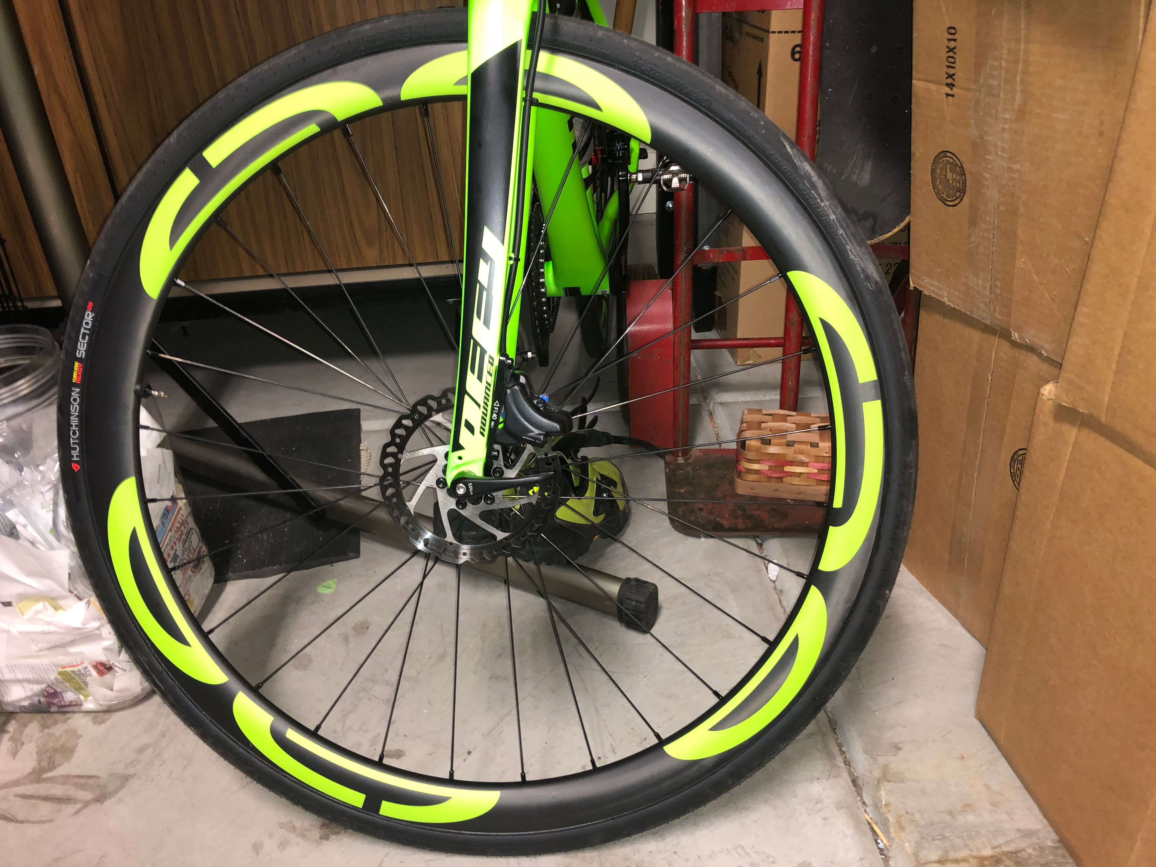 eie carbon road bike wheels with green eie decals 